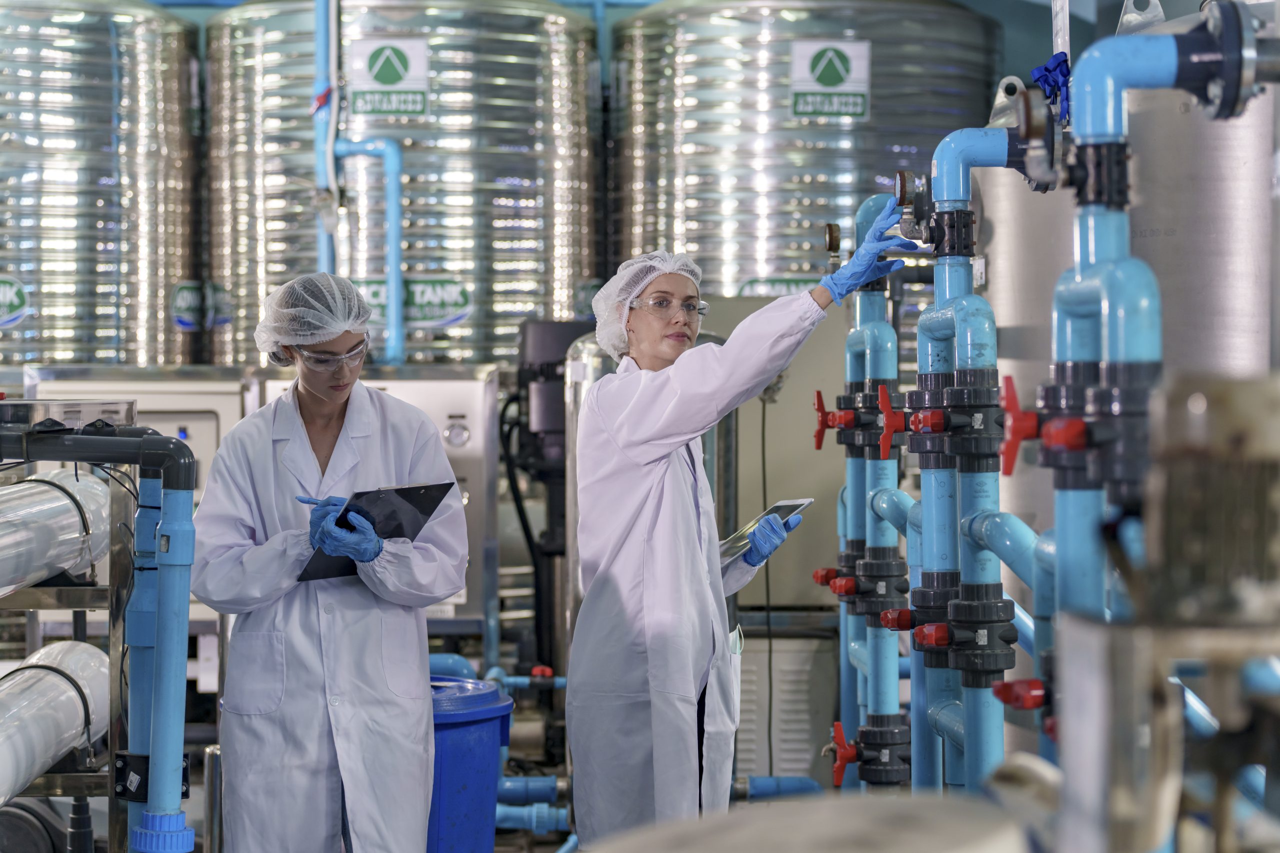 Scientists conducting water purification research in a modern laboratory setting
